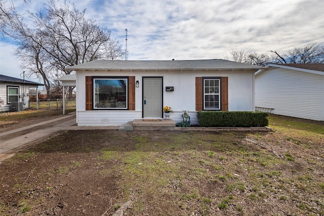 bungalow-style home with fence