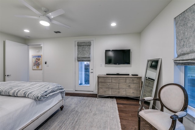 bedroom with dark wood-style floors, ceiling fan, visible vents, and recessed lighting