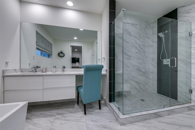 full bathroom with marble finish floor, a stall shower, a bathtub, and vanity