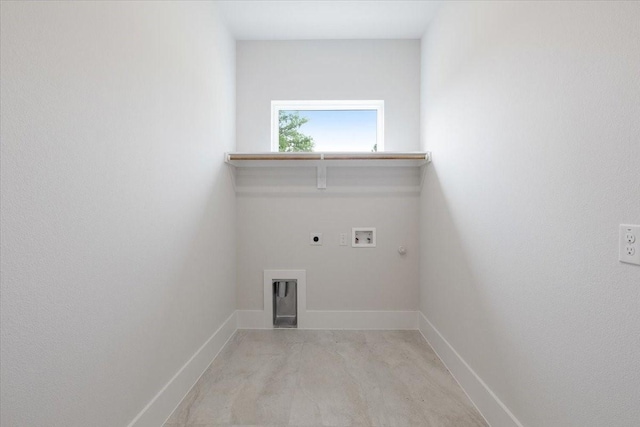 laundry area with gas dryer hookup, hookup for a washing machine, laundry area, baseboards, and electric dryer hookup