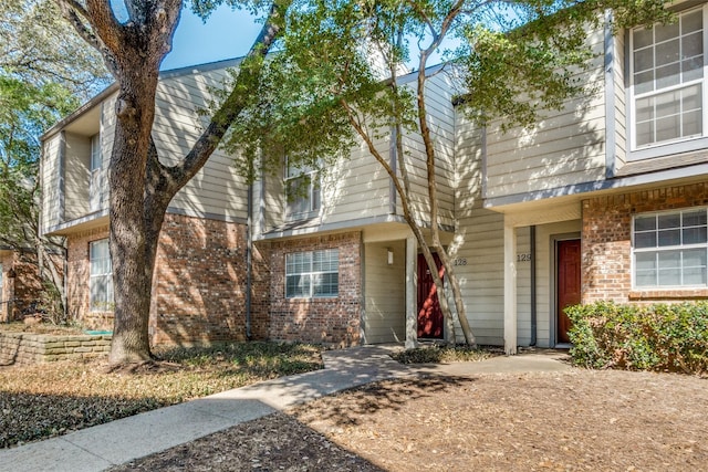 view of front of home featuring brick siding