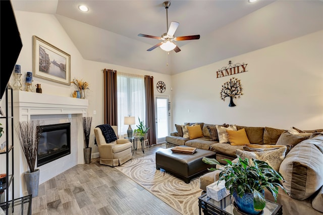 2101 Bishop Barrel Ln, Wylie, TX 75098 - living room with lofted ceiling, a tile fireplace, ceiling fan, recessed lighting, and light wood-style floors