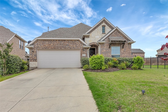 2101 Bishop Barrel Ln, Wylie, TX 75098 - french country inspired facade featuring brick siding, an attached garage, concrete driveway, and roof with shingles