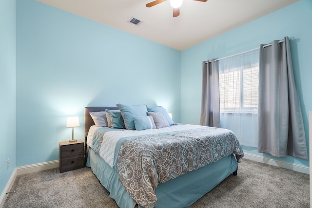 bedroom featuring ceiling fan, carpet, visible vents, and baseboards