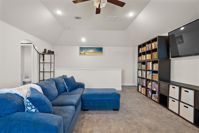 living area featuring lofted ceiling, carpet, and visible vents