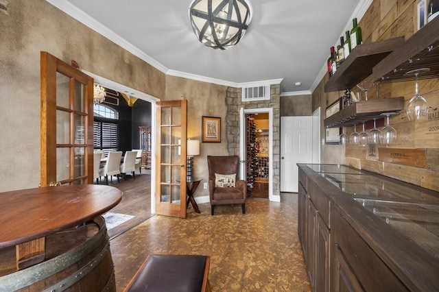 kitchen with french doors, a notable chandelier, open shelves, visible vents, and ornamental molding