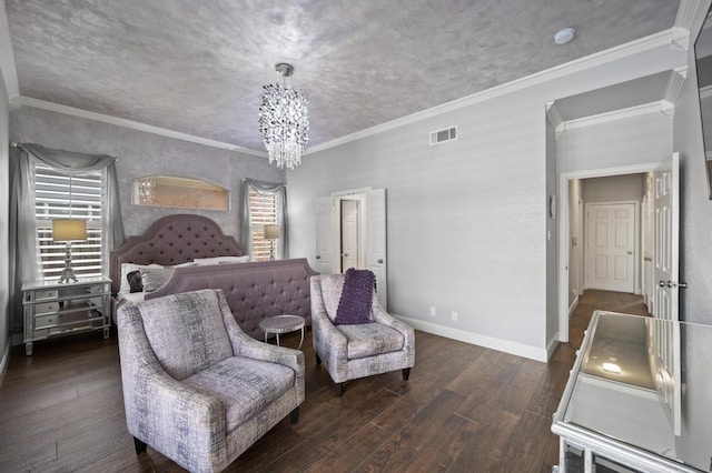 bedroom with crown molding, visible vents, wood finished floors, a chandelier, and baseboards