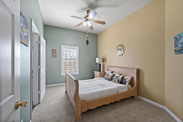 carpeted bedroom featuring ceiling fan and baseboards