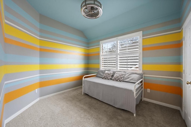 carpeted bedroom featuring lofted ceiling and baseboards