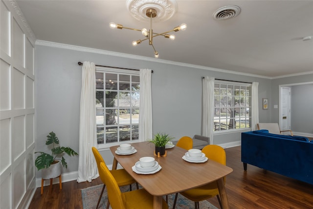 dining area featuring ornamental molding, visible vents, baseboards, and wood finished floors