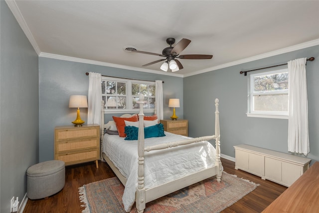 bedroom with dark wood-style flooring, a ceiling fan, baseboards, visible vents, and crown molding