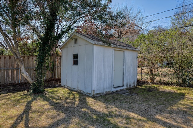 view of shed with a fenced backyard