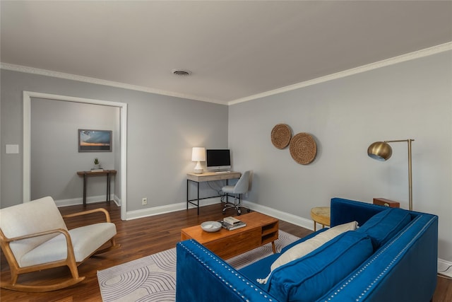 living area with baseboards, visible vents, wood finished floors, and ornamental molding