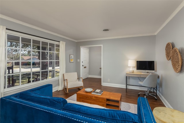 living room with ornamental molding, visible vents, baseboards, and wood finished floors