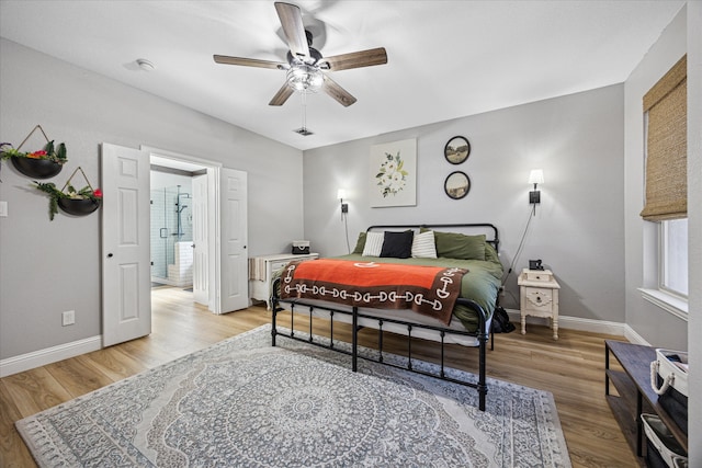 bedroom with ceiling fan, light wood finished floors, visible vents, and baseboards