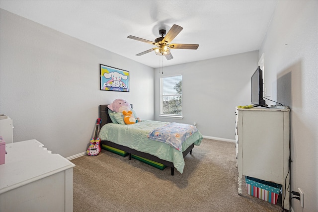 carpeted bedroom featuring ceiling fan and baseboards