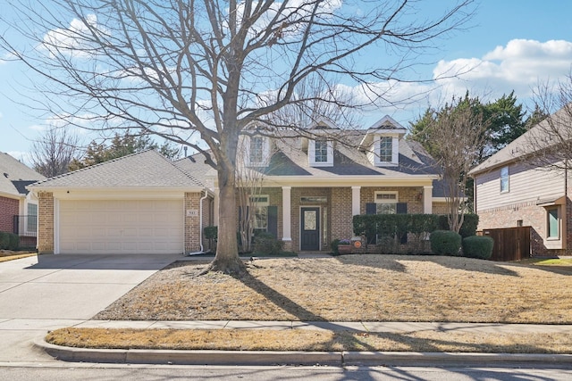 cape cod house with driveway, an attached garage, covered porch, fence, and brick siding