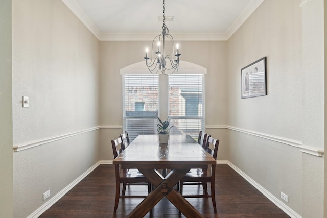 dining area with baseboards, a chandelier, wood finished floors, and ornamental molding