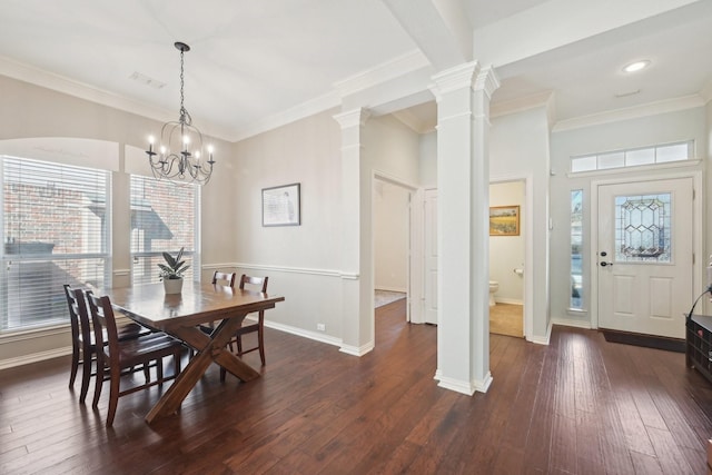 dining space featuring baseboards, ornamental molding, dark wood-style flooring, an inviting chandelier, and ornate columns