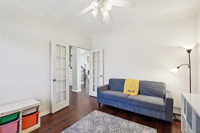 living room featuring french doors, crown molding, a ceiling fan, baseboards, and hardwood / wood-style flooring