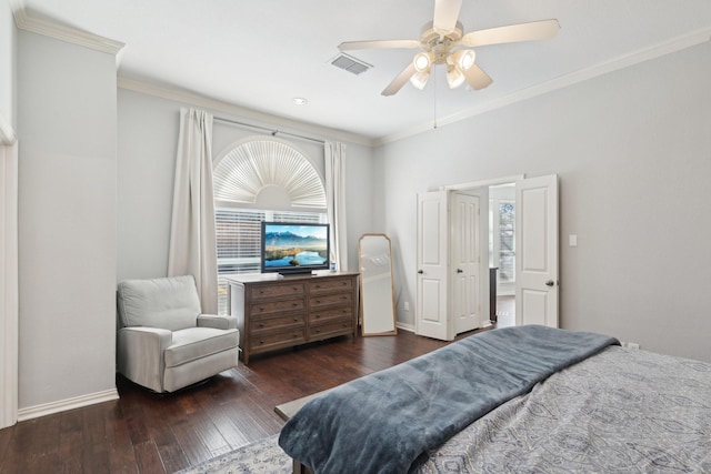 bedroom with baseboards, visible vents, ceiling fan, hardwood / wood-style floors, and crown molding