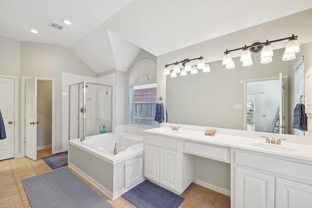 bathroom with a garden tub, tile patterned flooring, a sink, and a shower stall