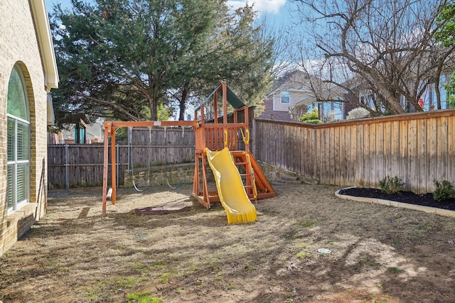 view of play area with a fenced backyard