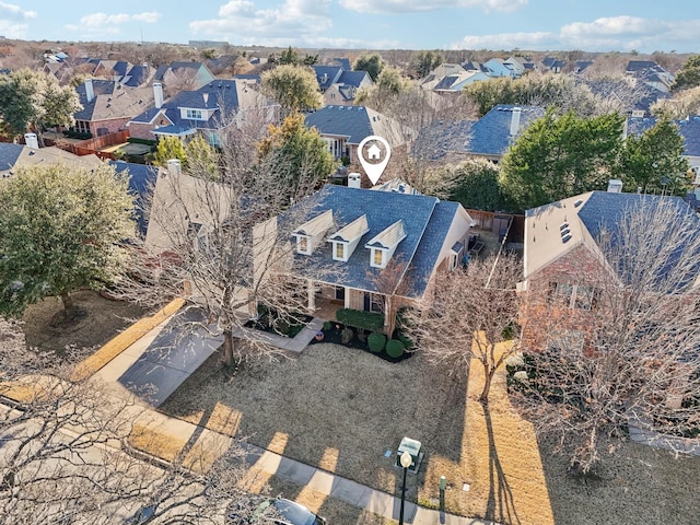 birds eye view of property with a residential view