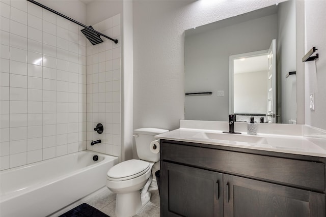 bathroom with tile patterned flooring, vanity, toilet, and bathing tub / shower combination