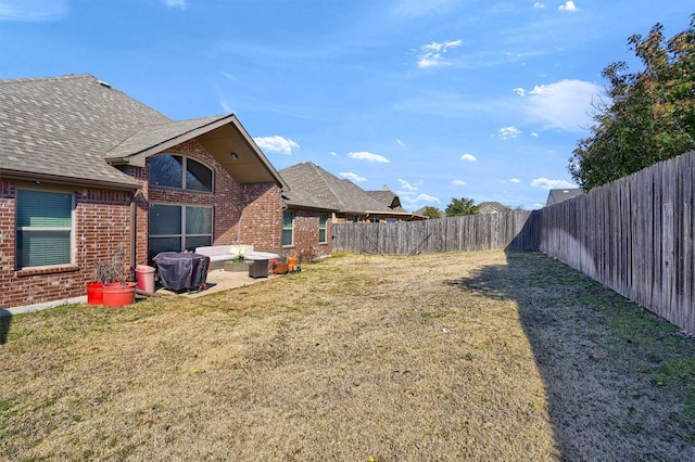 view of yard featuring a fenced backyard