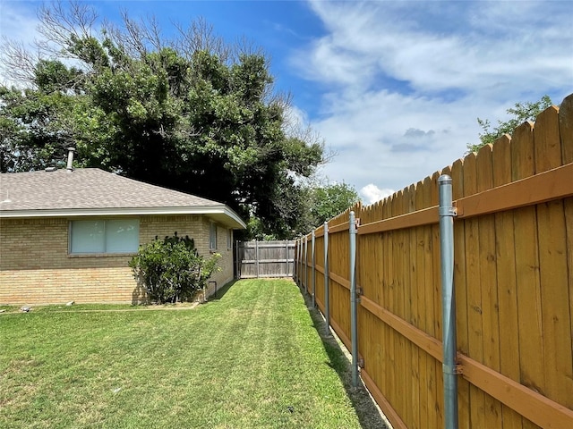 view of yard featuring a fenced backyard