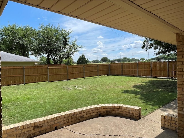 view of yard with a fenced backyard