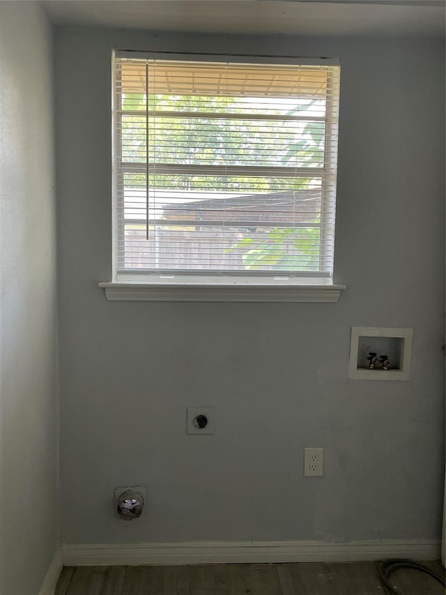 laundry area with laundry area, washer hookup, a wealth of natural light, and electric dryer hookup