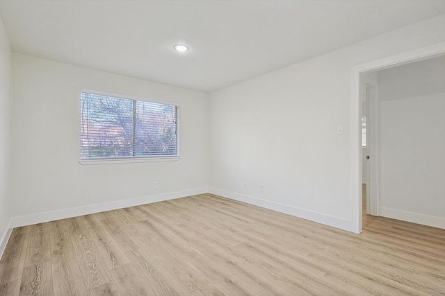 1907 Nevada St, Denton, TX 76209 - unfurnished room featuring light wood finished floors, baseboards, and recessed lighting