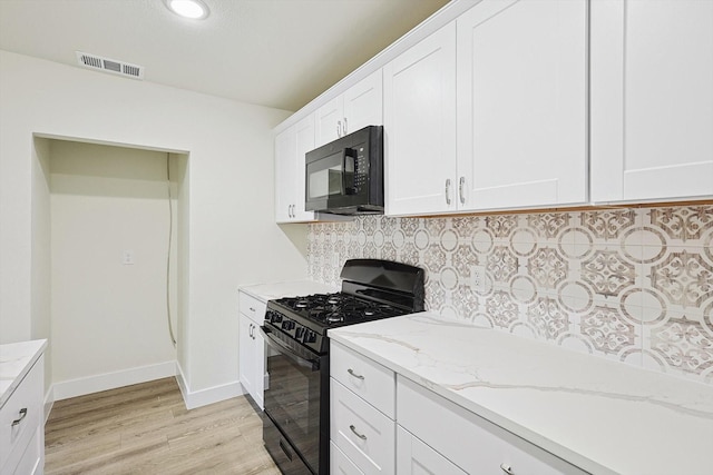 1907 Nevada St, Denton, TX 76209 - kitchen with black appliances, light wood-style flooring, backsplash, light stone counters, and white cabinets