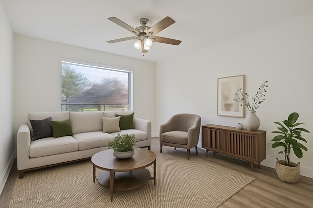 1907 Nevada St, Denton, TX 76209 - living area featuring radiator heating unit, wood finished floors, ceiling fan, and baseboards
