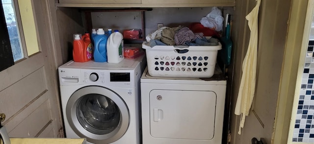 washroom featuring washing machine and dryer