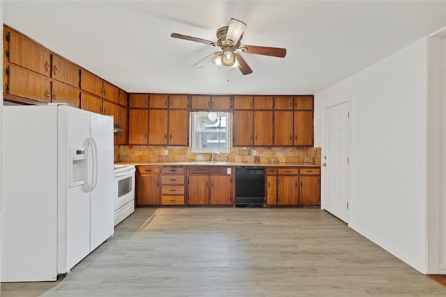 kitchen featuring tasteful backsplash, light countertops, white appliances, and brown cabinets