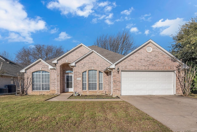 single story home featuring a garage, concrete driveway, central air condition unit, a front lawn, and brick siding