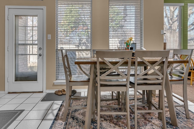 dining area featuring a healthy amount of sunlight and tile patterned floors