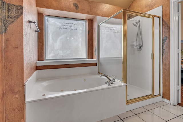 bathroom with a stall shower, tile patterned flooring, and a whirlpool tub