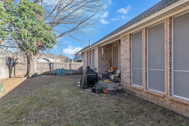 view of yard featuring a patio area and a fenced backyard