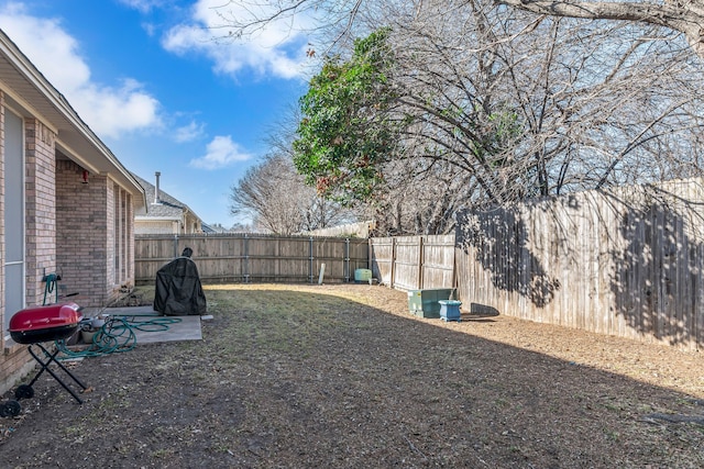 view of yard with a fenced backyard