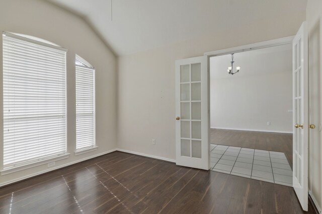 foyer with light wood finished floors, baseboards, and visible vents