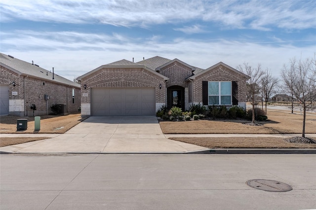 view of front facade featuring a garage, concrete driveway, roof with shingles, cooling unit, and brick siding