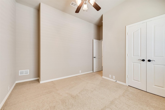 unfurnished bedroom with carpet, visible vents, and baseboards