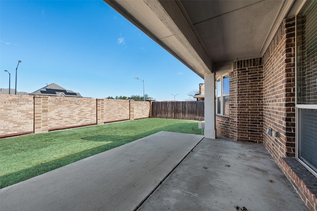 view of patio featuring a fenced backyard