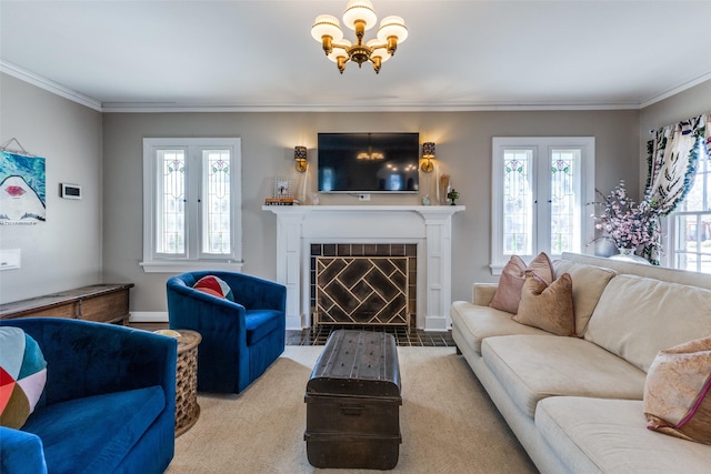 living area featuring ornamental molding, a tile fireplace, and a healthy amount of sunlight