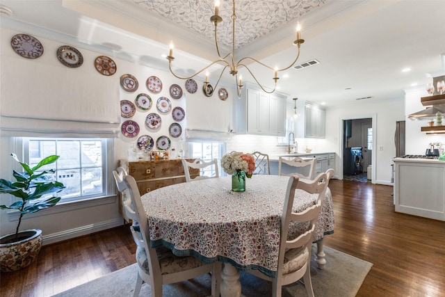 dining area featuring dark wood-style flooring, visible vents, crown molding, and baseboards