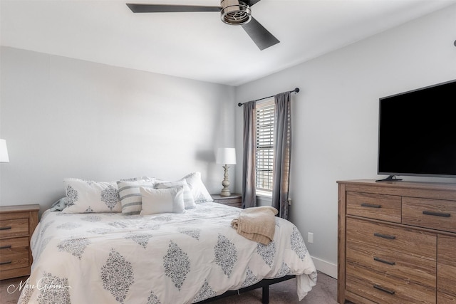 carpeted bedroom with a ceiling fan and baseboards